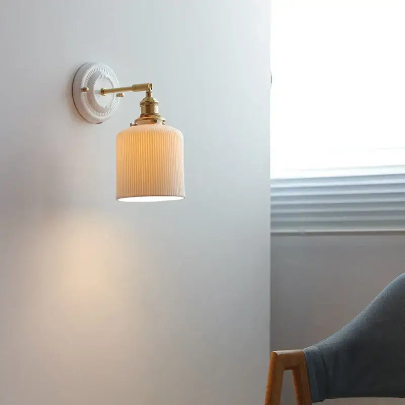 Cream ceramic led wall light with copper arm bedroom sconce