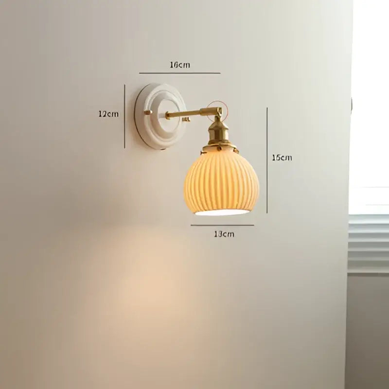 Cream ceramic led wall light with copper arm bedroom sconce