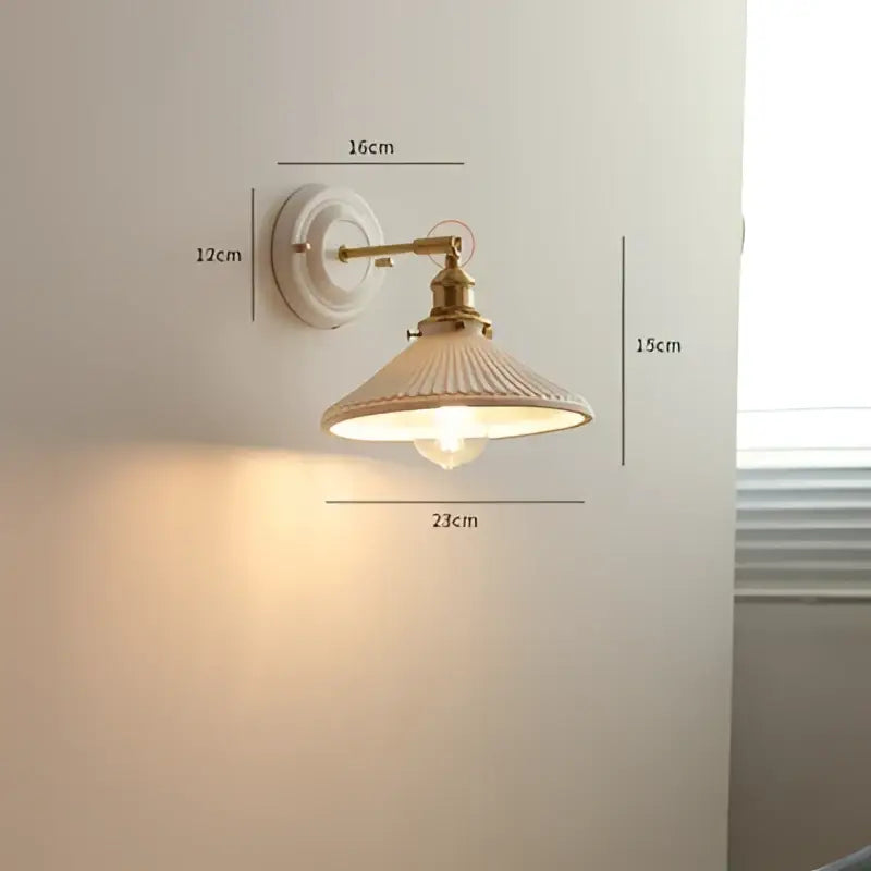 Cream ceramic led wall light with copper arm bedroom sconce