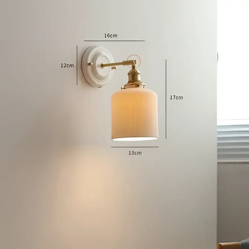 Cream ceramic led wall light with copper arm bedroom sconce