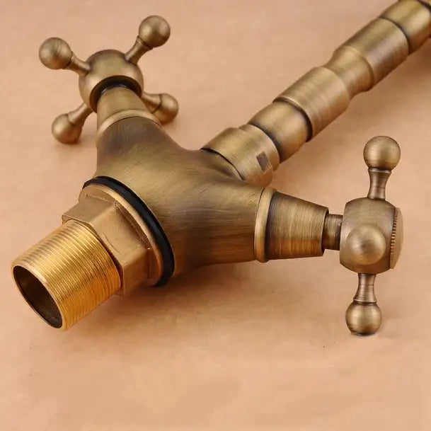 DecorBites™ Antique Brass Double Cross Handle Basin Faucet - 360 Degree Swivel Spout