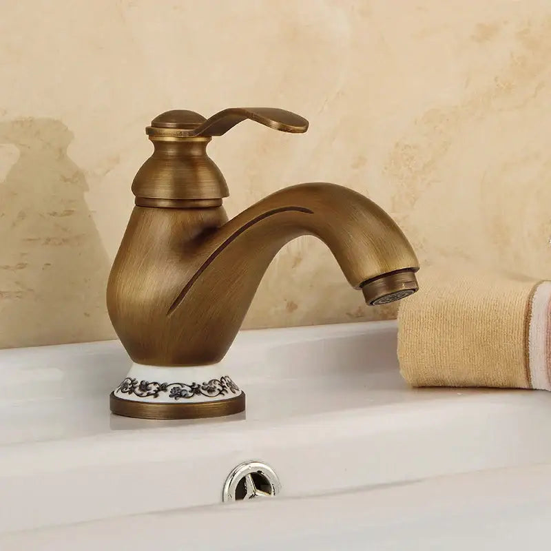 DecorBites™ Antique Brass Single Handle Deck Mount Bathroom Sink Faucet.