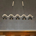 DecorBites black island pendant features five black metal shades suspended by hemp rope with brass accents
