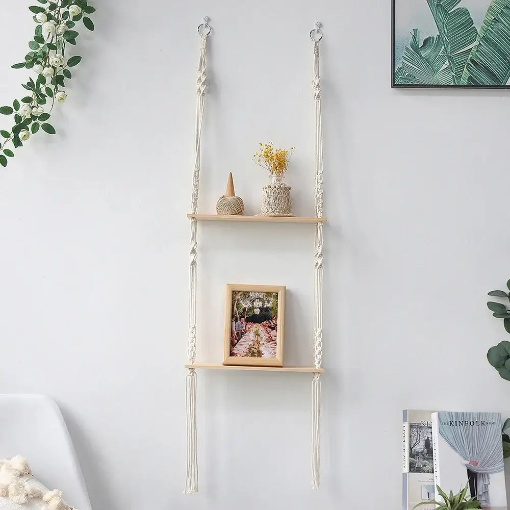 Cream-colored DecorBites™ boho macrame wall shelf with wooden slats and decorative knots for home decor