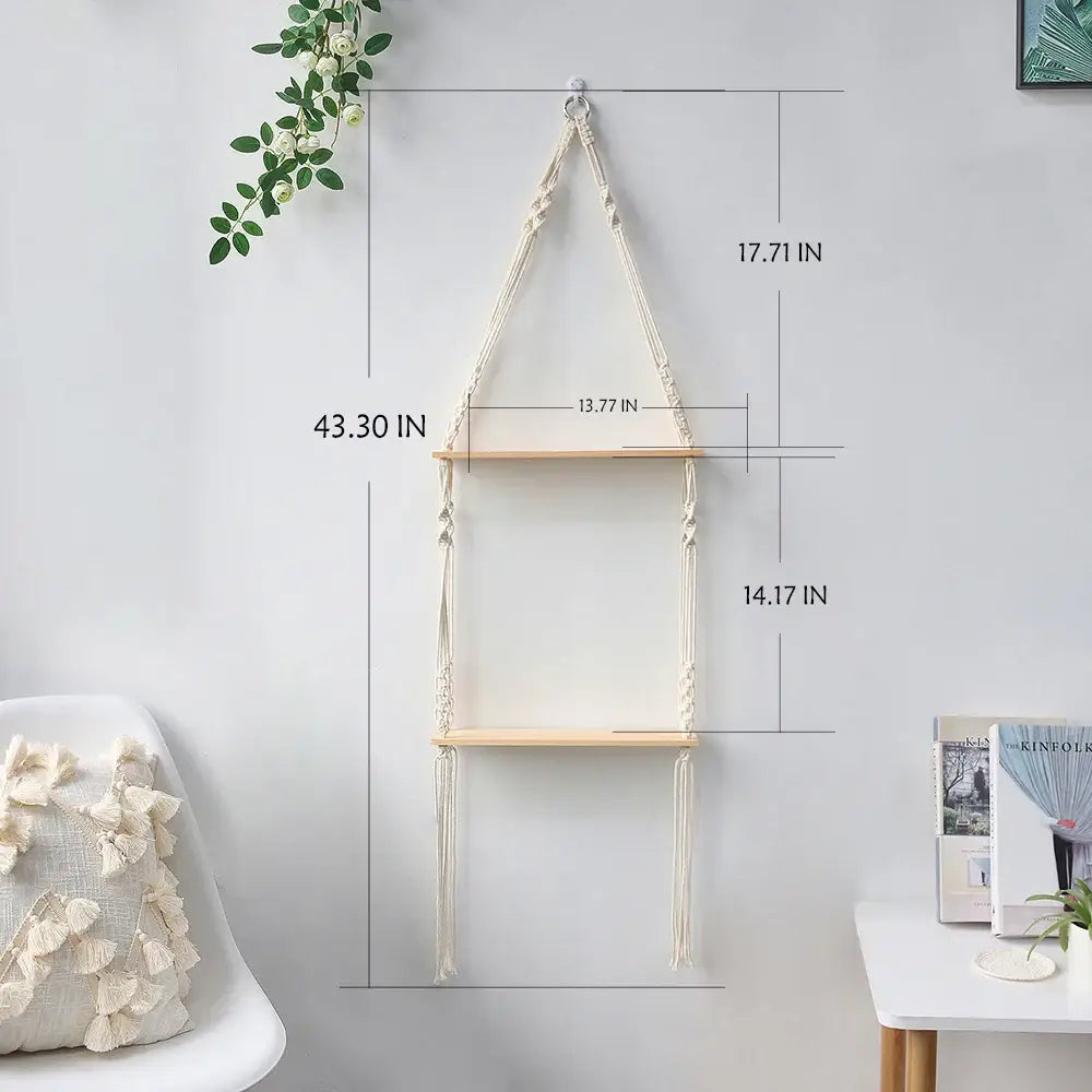 Cream-colored boho macrame wall shelf by decorbites with two light wood shelves and decorative knots for home decor