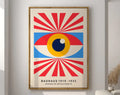 A framed DecorBites™ bright geometric canvas print featuring a bauhaus-style eye with red and blue rays on off-white background