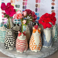 A collection of colorful ceramic cat vases with polka dot patterns from decorbites™ for flower display
