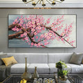 DecorBites™ cherry blossom canvas art features vibrant pink blossoms with dark brown branches in a sleek black frame for living room decor