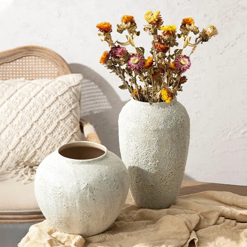 DecorBites™ chinese style ceramic vase in off-white textured ceramic holds dried orange and purple flowers for home decor