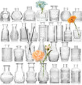 Decorbites clear glass bud vase bulk set featuring clear glass vases with intricate etched and faceted designs holding flowers