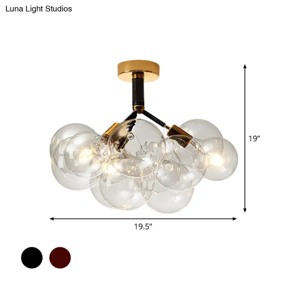 Gold-toned DecorBites™ semi flush ceiling light with clear glass globe bulbs in a contemporary bubble design for foyer illumination