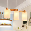DecorBites cluster pendant kitchen lamp with warm wood frame and white glass shade in modern design with 3 bulbs
