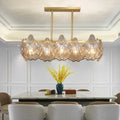 Decorbites contemporary amber crystal pendant light with five translucent glass shells and brass island lighting linear metal arm