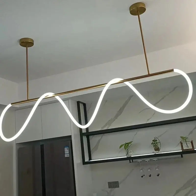 Modern gold-toned DecorBites contemporary led chandelier with a sleek wave-shaped long hose led strip for dining room lighting