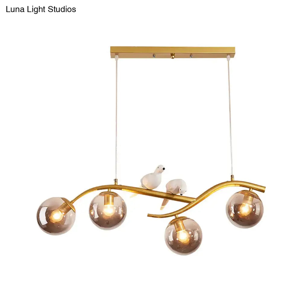 DecorBites™ Contemporary Metal Branch Hanging Lamp Island Pendant - 4-Light Black/Gold with Bird Deco and Smoke Grey/Cognac Glass Shade