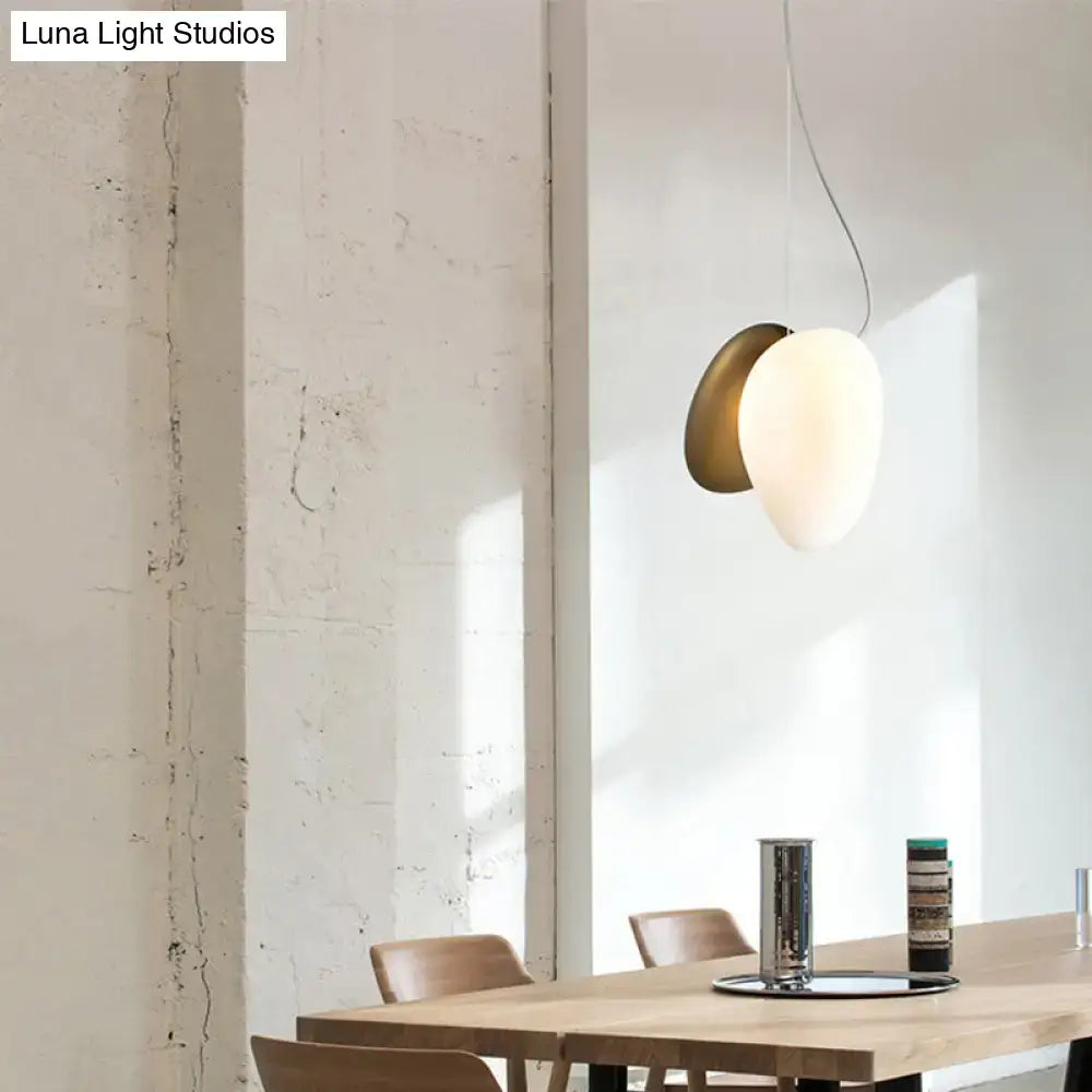 DecorBites™ contemporary white glass pendant light with matte white egg-shaped shade and brushed brass base for dining room
