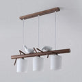 DecorBites contemporary wood island pendant with nutcracker design features cylindrical glass shades and e26 e27 bulbs