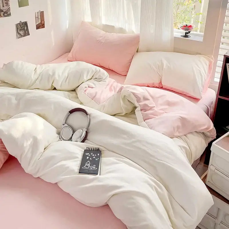 Soft white and blush pink cotton bedding set with duvet cover featuring a cozy layered look from decorbites cotton bedding