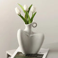 White ceramic human vase with integrated handle by DecorBites™ for stylish home decor and creative display