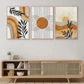Three framed abstract wall art prints with geometric sun and desert plants motifs in beige ochre black and white colors