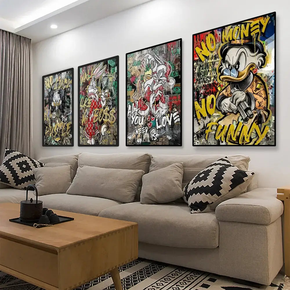 Four framed graffiti-style donald duck canvas wall art pieces with bold yellow text and vibrant colors above a beige sofa