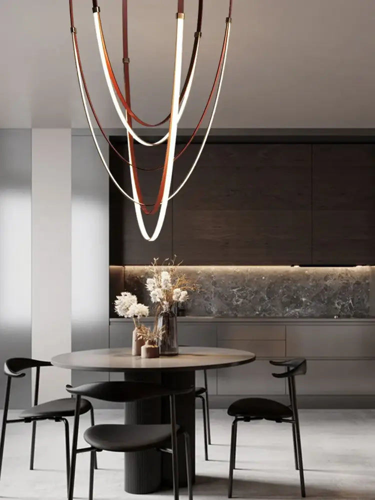 A modern decorbites™ diy flexible leather belt led chandelier with curved white and brown illuminated leather bands