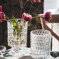 Clear glass crystal glass vase with geometric diamond-cut pattern and pedestal base for flower arrangement