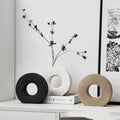 Three minimalist donut vases in black white and beige ceramic for elegant home decor and flower vase display
