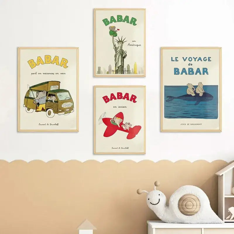 Set of four framed elephant babar family vintage-style posters in light wood frames for kids room decor
