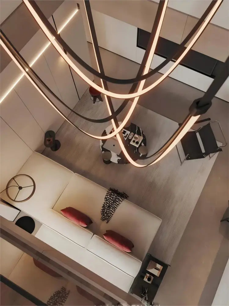 Modern minimalist decorbites™ flex leather belt led chandelier with sleek curved metallic arms and warm ambient lighting