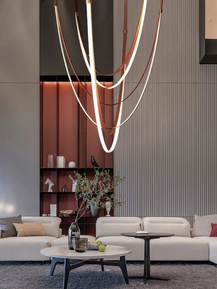 Modern sculptural DecorBites™ flexible leather belt LED chandelier with intertwined copper and white light strips