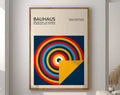 DecorBites™ geometric bauhaus canvas poster with bold red yellow and blue concentric circles on navy for home decor