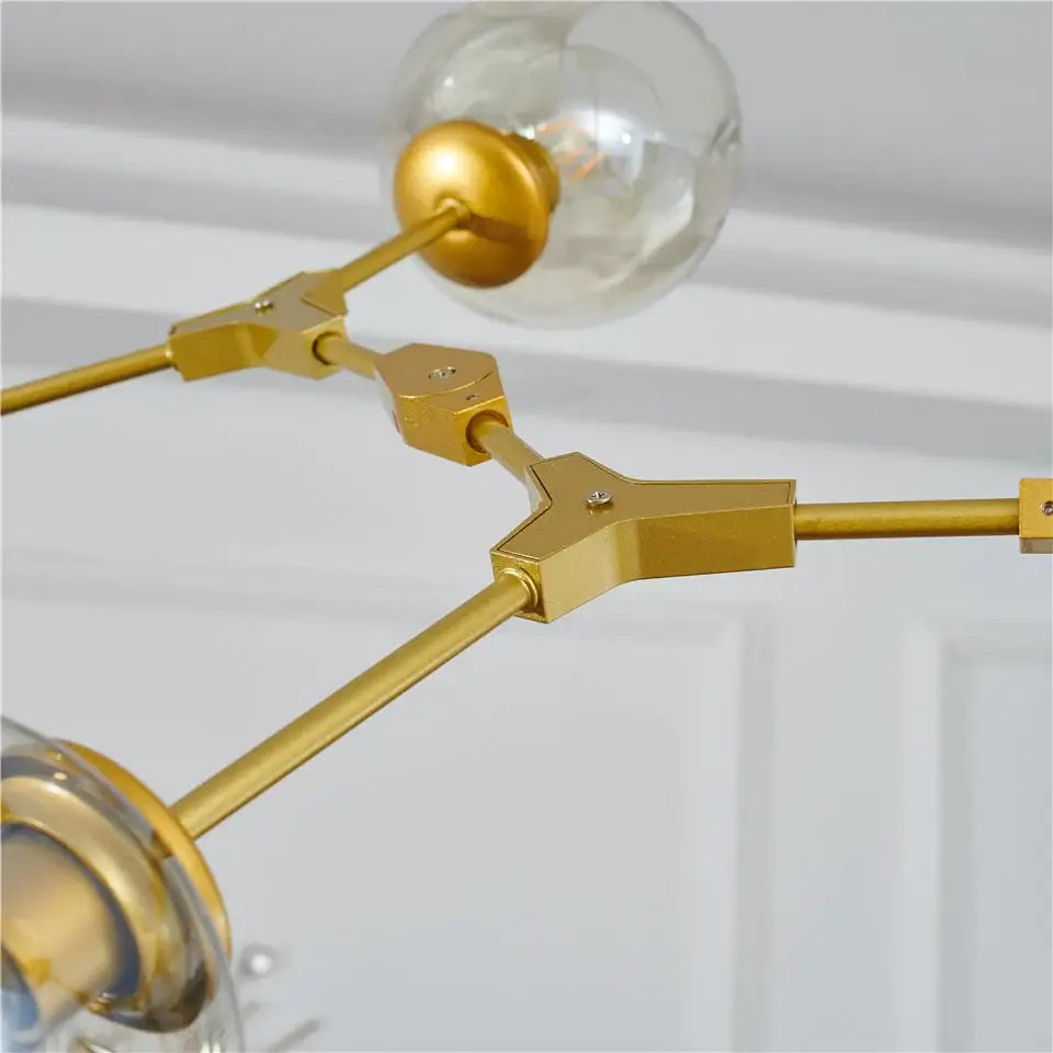 Gold-toned metal DecorBites™ Nordic style glass ball led chandelier with clear glass globe ball led bulbs