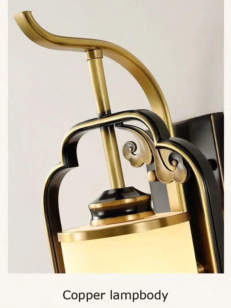Ornate brass glass wall lamp for living room with frosted shade
