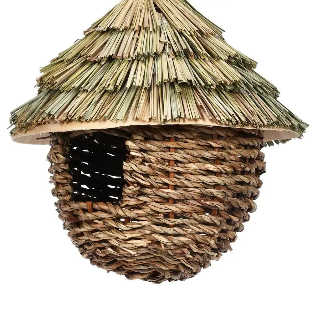DecorBites™ handwoven hummingbird house with a thatched roof of dried reeds and natural twine featuring a square entrance