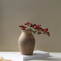 Earthenware handmade ceramic vase by decorbites with subtle ridges and warm beige finish for home decoration
