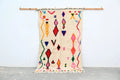 Beige moroccan handmade azilal rug with vibrant geometric patterns in natural wool by DecorBites 231x131cm