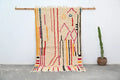 Beige DecorBites™ handmade traditional azilal rug with vibrant red orange yellow black and blue geometric patterns 253x144 cm fringe edge