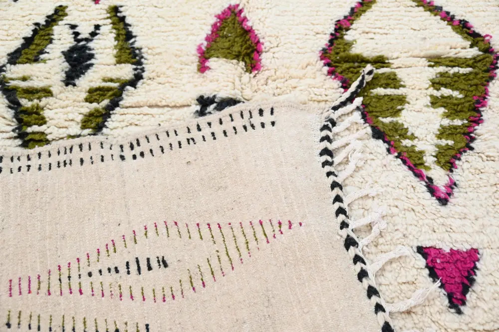 Cream-colored decorbites handmade moroccan azilal rug with geometric olive green magenta pink and black patterns 302x197 cm
