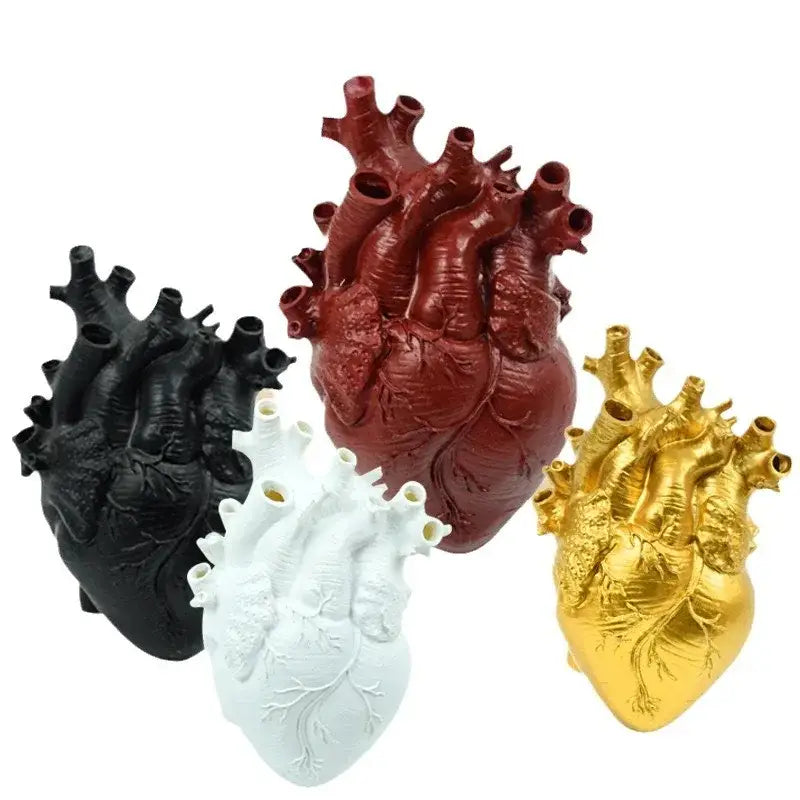 A set of four anatomically detailed black red white and gold resin heart shape vases from decorbites
