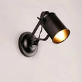 Black industrial-style DecorBites™ aleah wall sconce with matte finish and gold-lined interior for elegant lighting