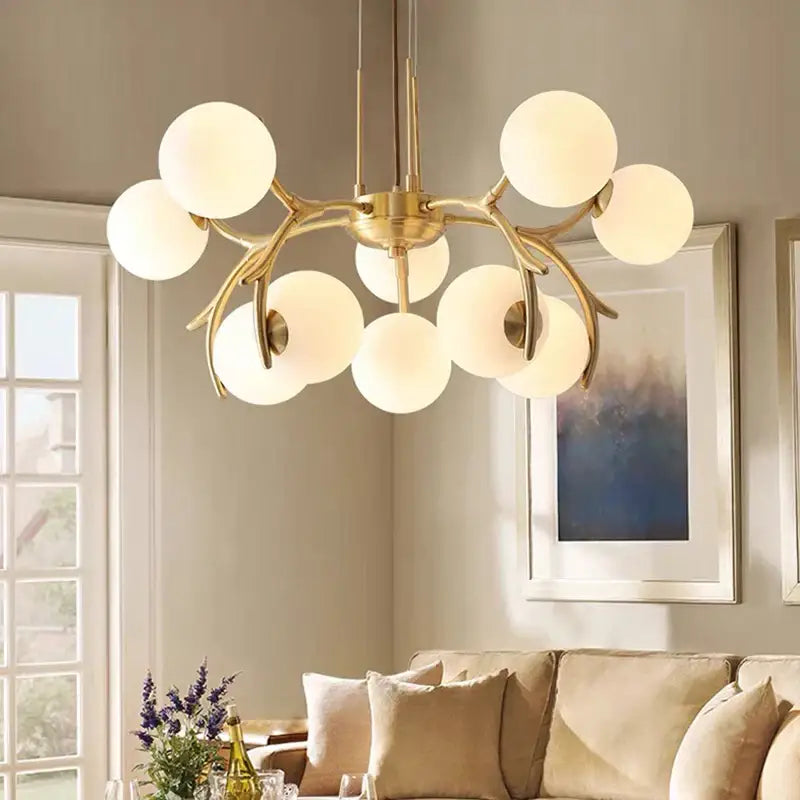Organic gold led chandelier lighting with frosted globes for dining room