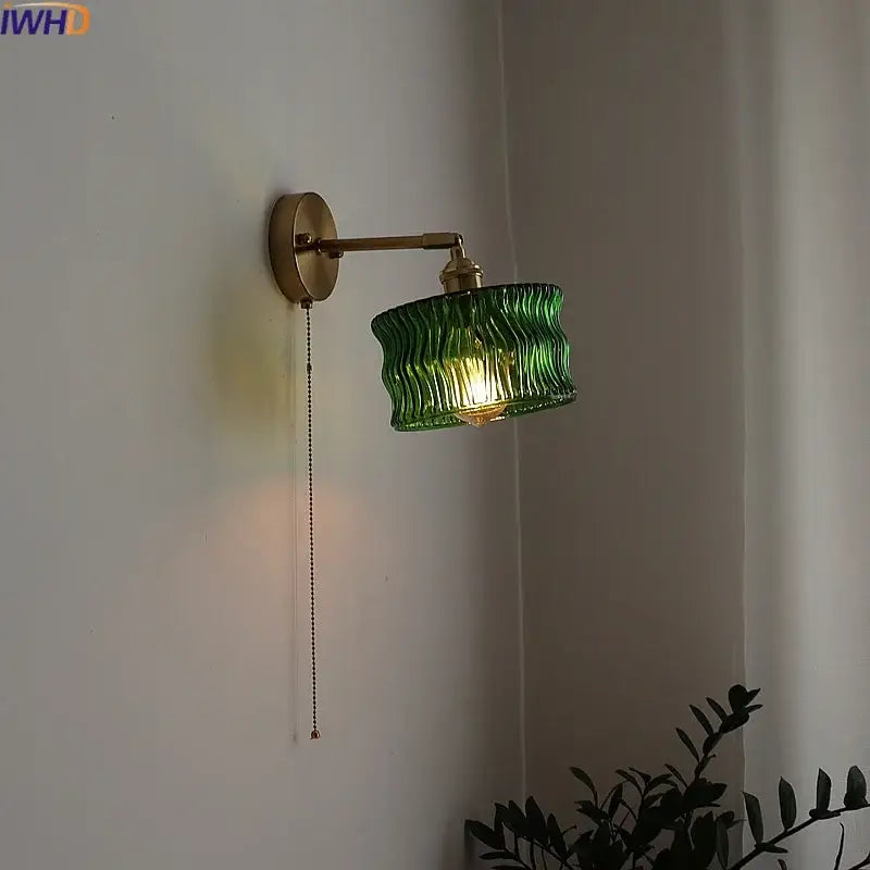 Green ribbed glass wall sconce with pull chain switch for bedroom