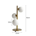 Modern gold 3 globe table lamp with milk white glass for bedroom
