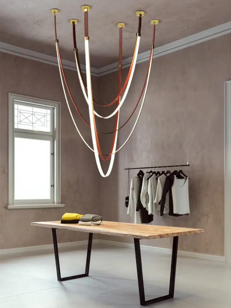 A modern DecorBites™ LED leather belt chandelier with curved illuminated strips for trendy diy flexible living room decor