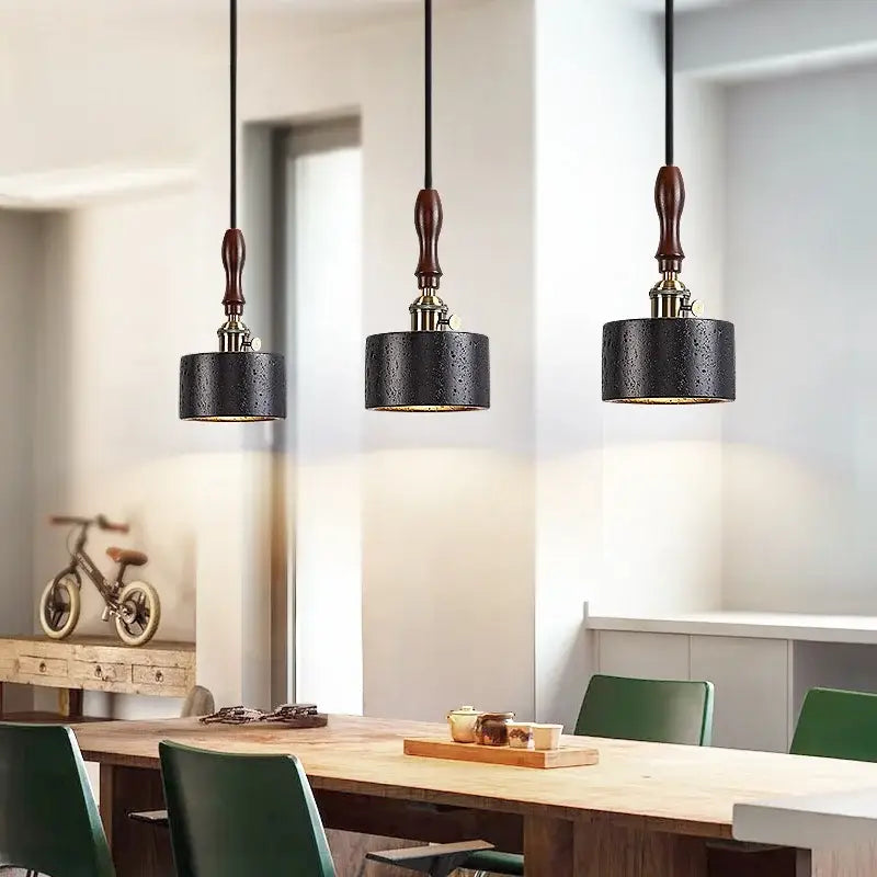 Black travertine cylindrical pendant light for dining room