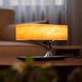 Decorbites™ life table lamp with warm amber acrylic shade and sleek metallic tree base on black circular stand