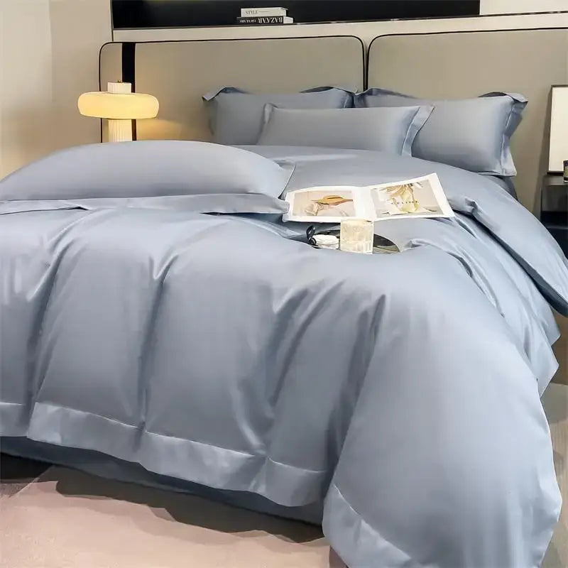 Light blue satin duvet cover set with matching pillows and stitched edges in DecorBites™ 1000TC Egyptian cotton bedding