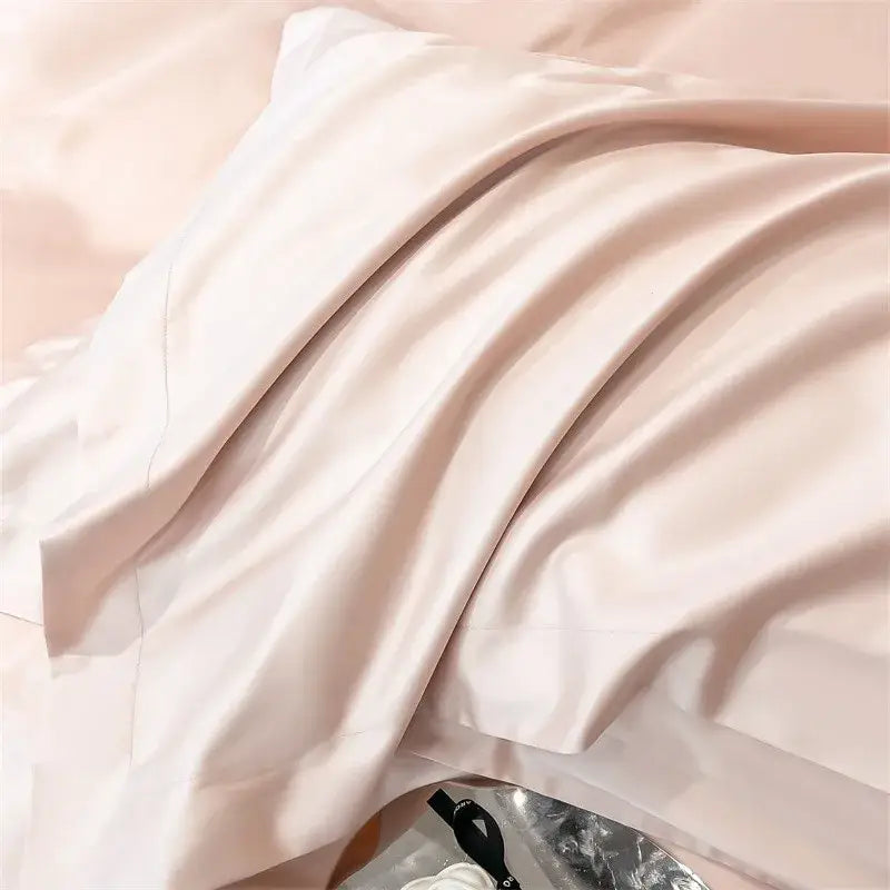 A soft blush-pink satin pillowcase from decorbites™ luxurious 1000tc egyptian cotton bedding set with fitted sheet