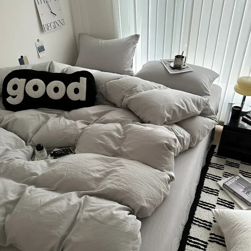 Black and white good word pillow with plush fabric complementing the decorbites luxurious cotton bedding set